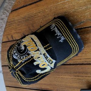 Designer Colorado all cap by Robin Ruth. Never worn. Fits all. Black and gold.